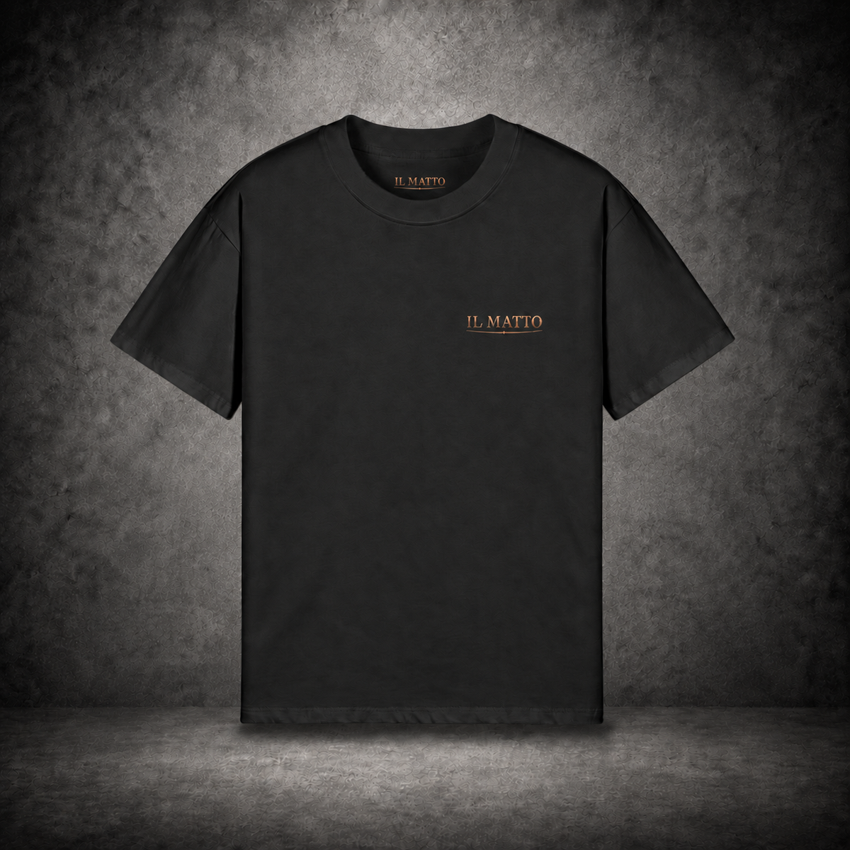 IL MATTO Everyday black tee with small antique-bronze chest wordmark — branded hero