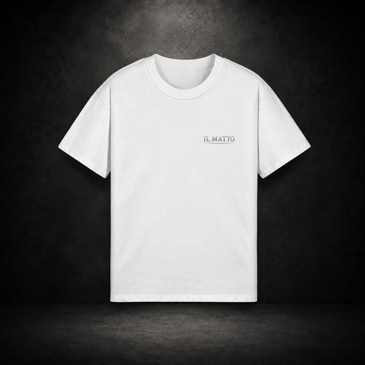 IL MATTO Everyday white tee with small aged-silver chest wordmark — branded hero