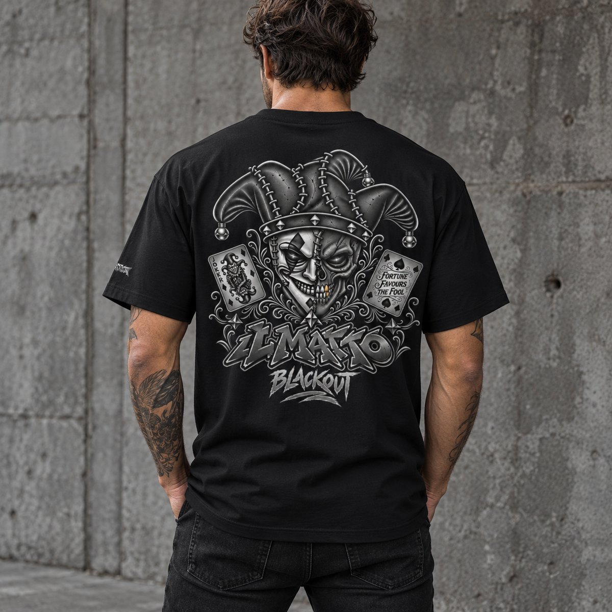 IL MATTO BLACKOUT Signature Tee in black — back-view lifestyle with updated Fortune Favours the Fool artwork