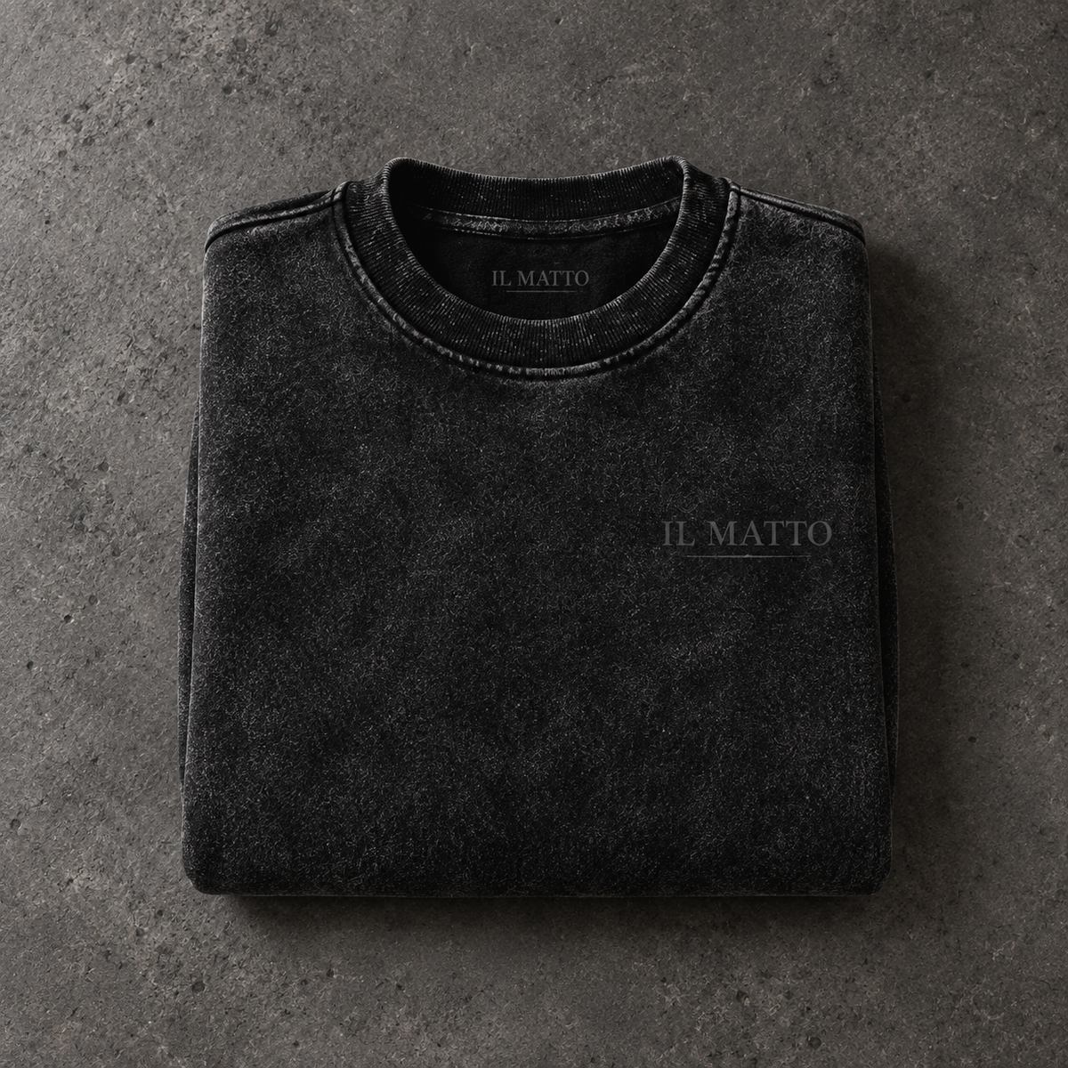IL MATTO Charcoal Signature Crew — folded product AI-generated styling mockup