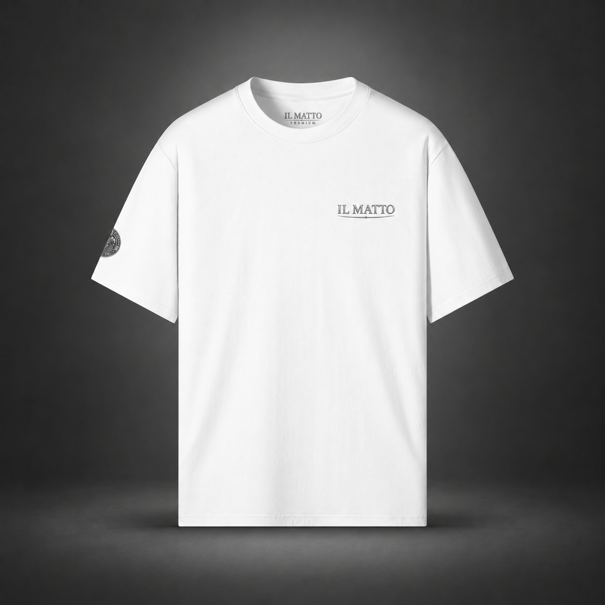 IL MATTO Premium Emblem Tee — white front on charcoal studio background