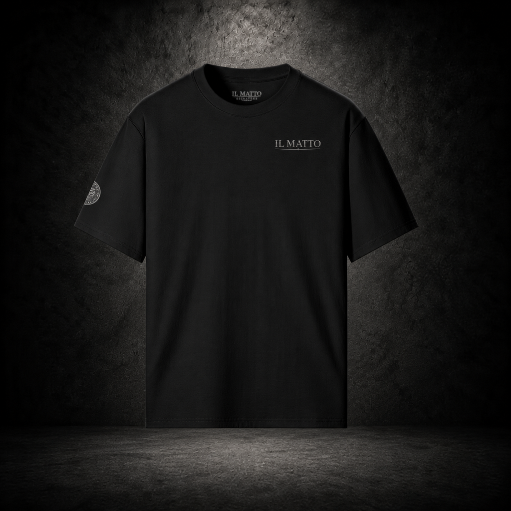 IL MATTO Signature Tee — black front on charcoal studio background