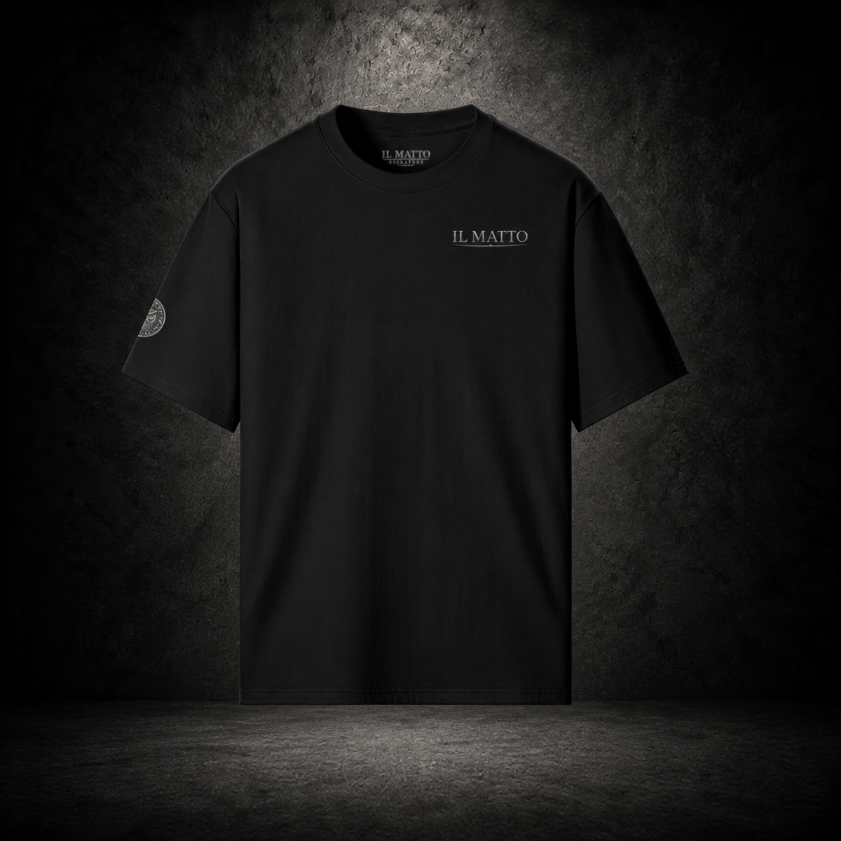 IL MATTO Signature Tee — black front on charcoal studio background