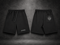 IL MATTO BLACKOUT black Signature Shorts, front logo and rear-pocket artwork, charcoal studio
