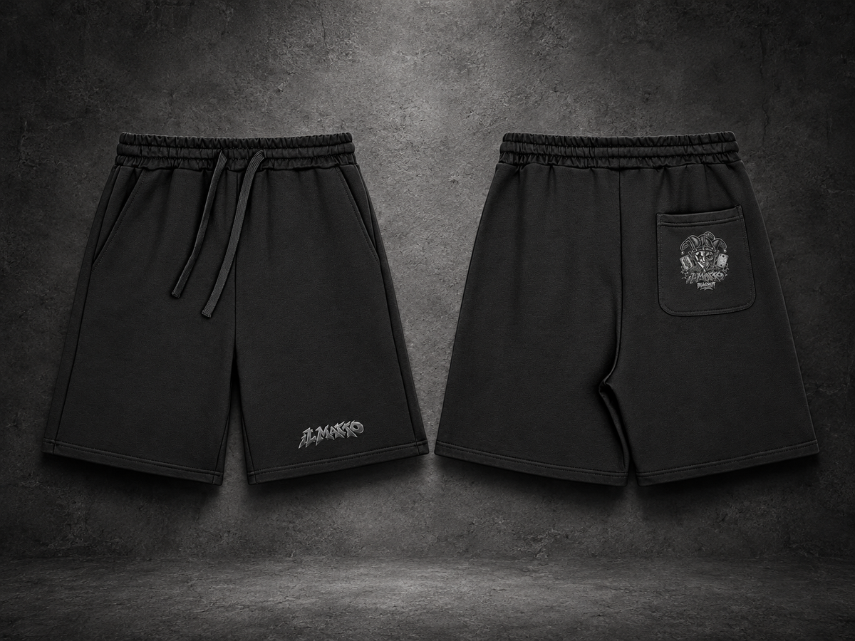 IL MATTO BLACKOUT black Signature Shorts, front logo and rear-pocket artwork, charcoal studio